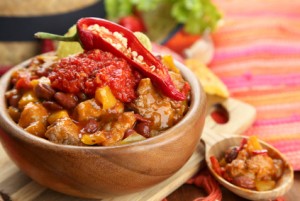 Chili Corn Carne - traditional mexican food, in wooden bowl,