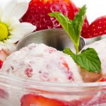 Strawberry ice cream with fruits close up