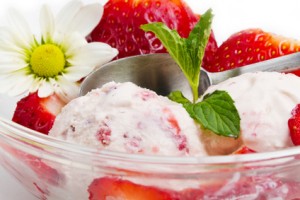 Strawberry ice cream with fruits close up