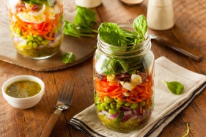 43209229 - healthy homemade mason jar salad with egg bacon lettuce and veggies