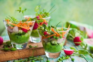 Spring appetizer with raw vegetables and green pea hummus