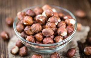 Hazelnuts on vintage wooden background (selective focus; close-up shot)