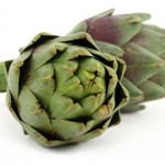 two artichoke over white